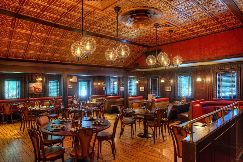 Main dining room with view of multiple set tables