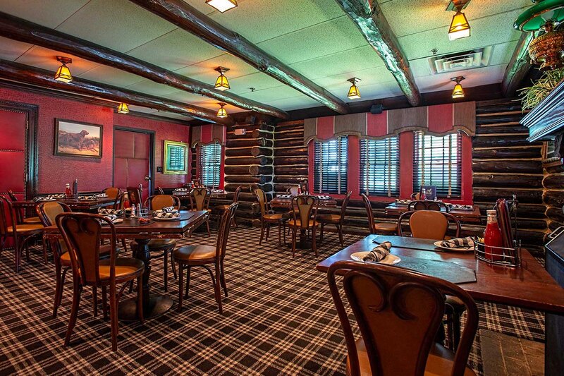 Back dining room with view of six tables
